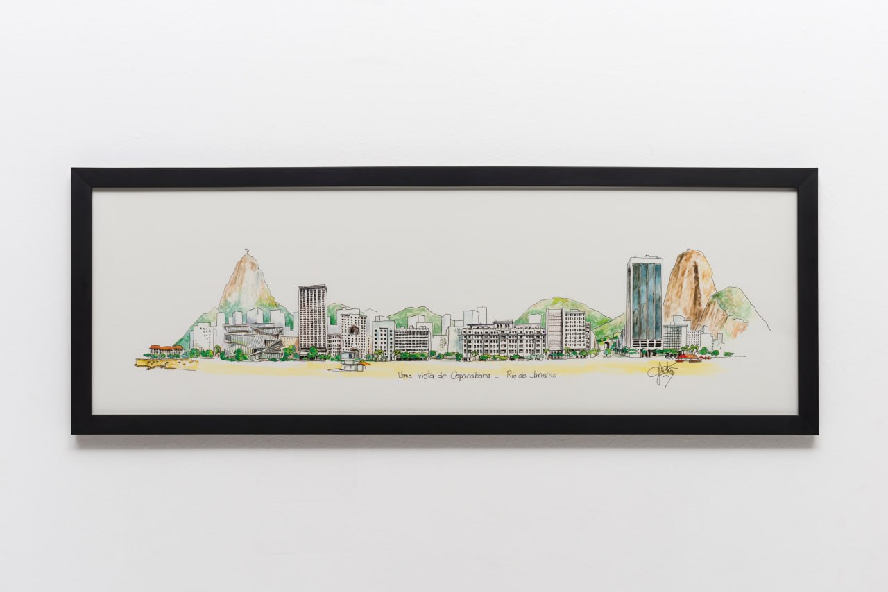 Quadro de Copacabana com moldura preta em parede branca