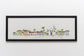Quadro do Quadrado de Trancoso, Bahia, com moldura preta em parede branca